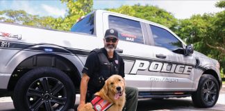 Corporal Jeff Perry of Naples Police Department with Max. Photo courtesy of Courtesy of Golden PAWS Assistance Dogs