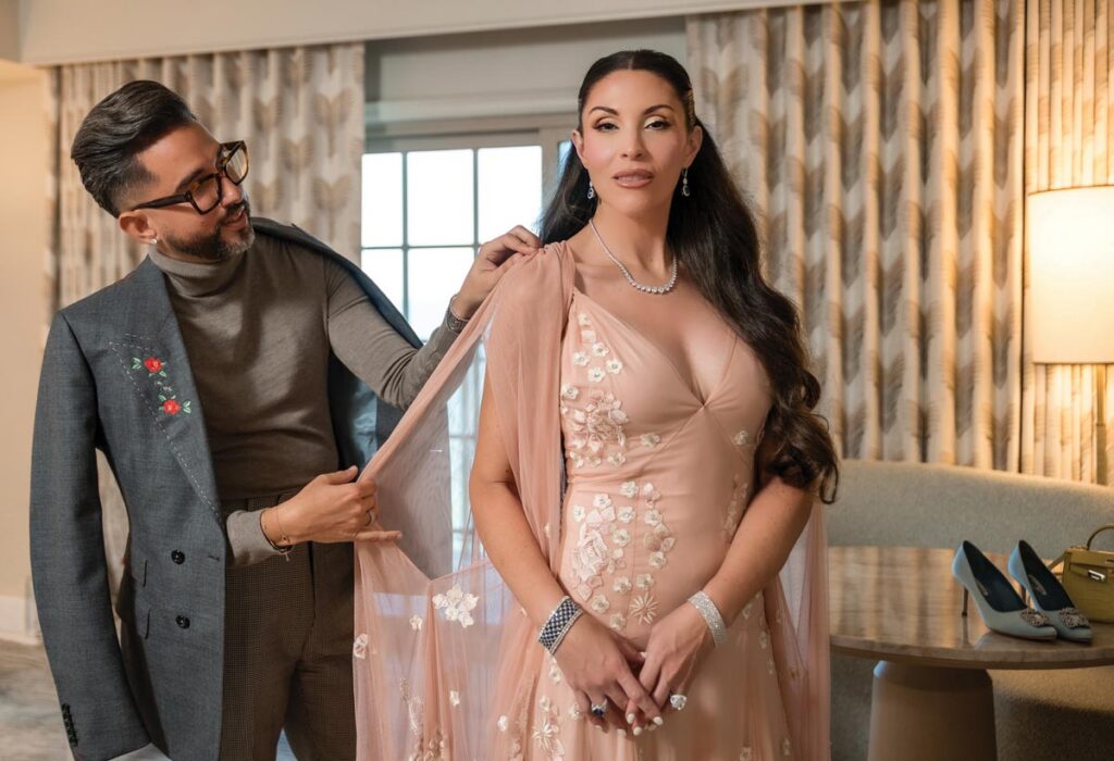 Escoto dressing Amanda Schmoyer. Photo by Anna Nguyen
