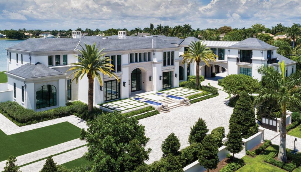 A view of the front of the Hoffmanns’ home, which features an array of greenery and two water features flanking the walkway. Photo by Nick Shirghio