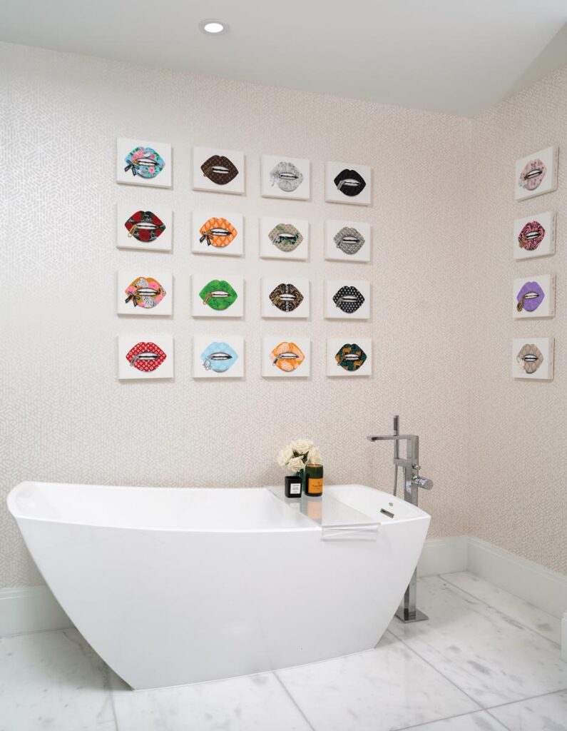 Her bathroom displays several works from artist Lina Valentina. Photo by Nick Shirghio