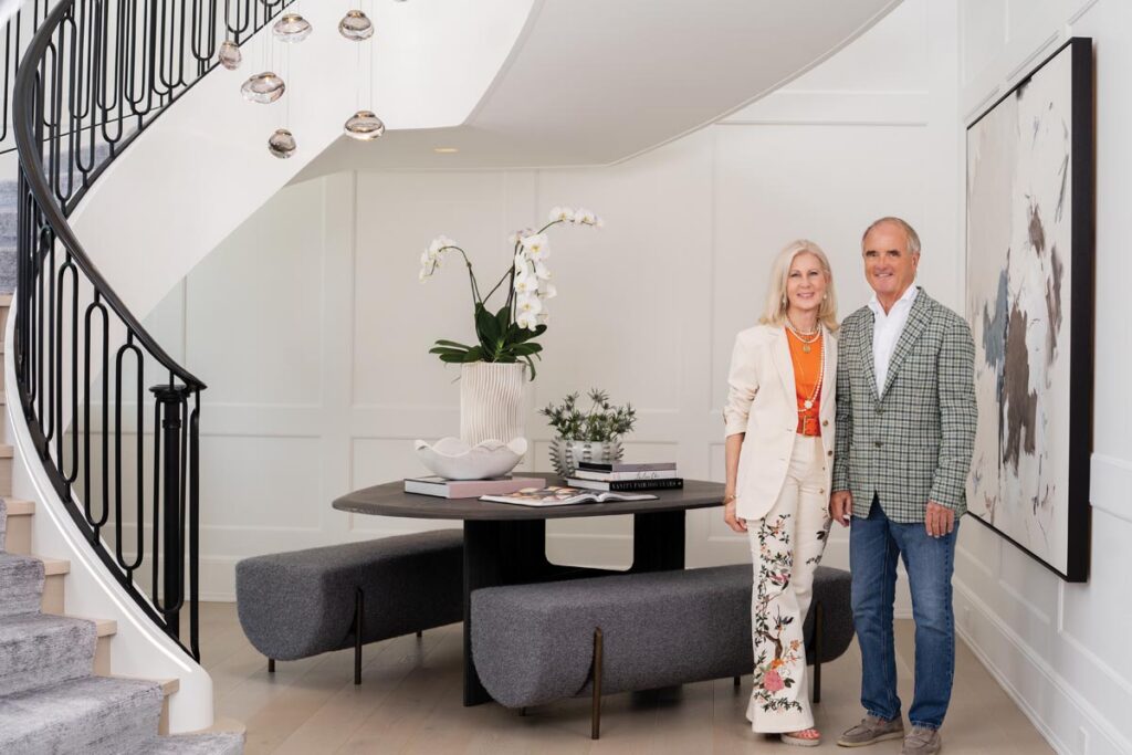 Jerri and David Hoffmann stand within their 17,200-square-foot residence, one of two dwellings on their Port Royal property. Photo by Nick Shirghio