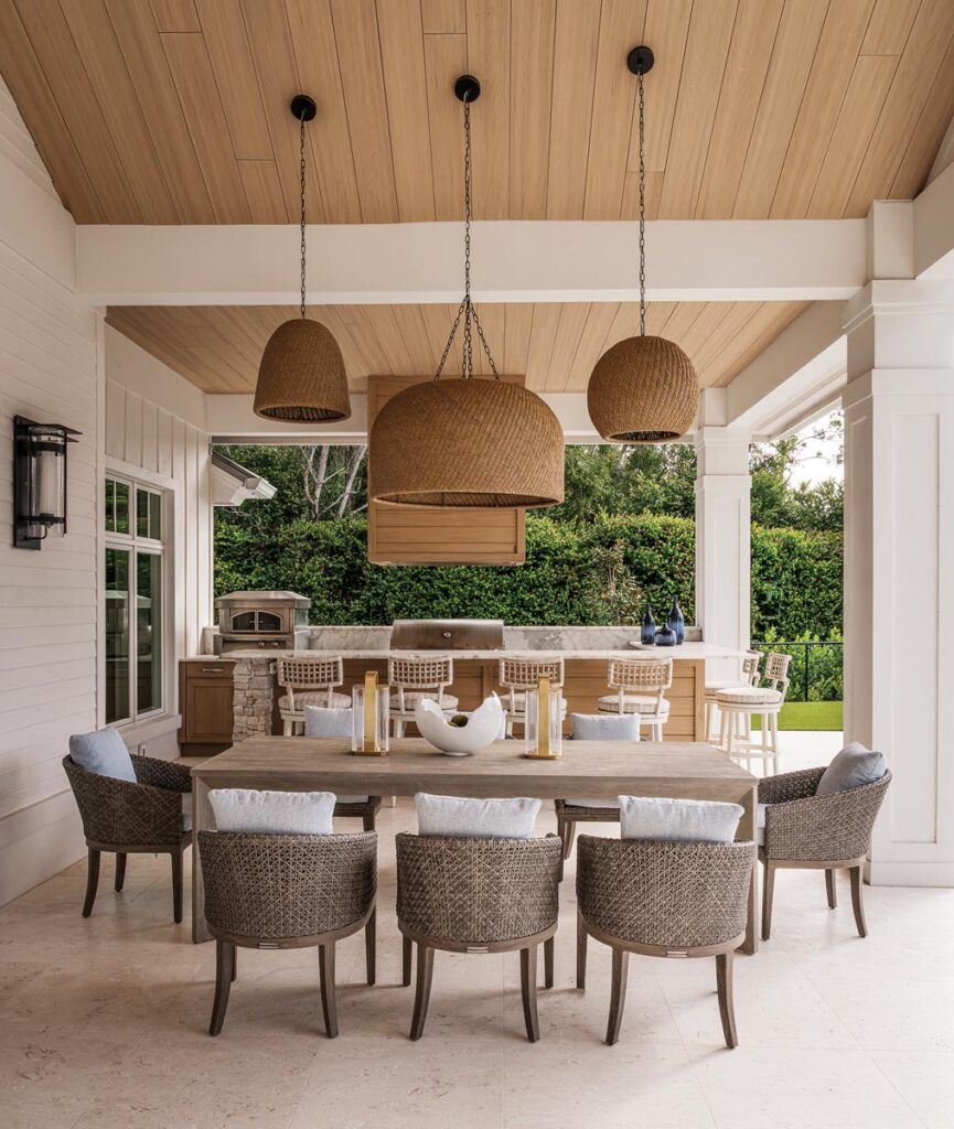 A coastal-inspired outdoor kitchen with a pizza oven for entertaining. Photo by Venjhamin Reyes