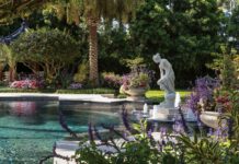 Local Landscape Architects on Cultivating Paradise A stately Roman sculpture anchors a curved pool. Photo by Ed Chappell