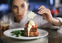 A Splash of Drama at Eddie V’s Prime Seafood Filet medallions with lobster tail, Oscar style. Photo courtesy of Eddie V’s Prime Seafood