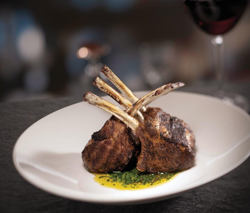 Morel-crusted lamb chops. Photo courtesy of Eddie V’s Prime Seafood
